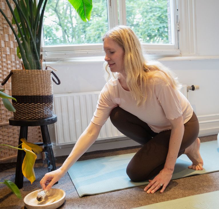 Marieke just after a 1:1 session cleansing the room with burning sage